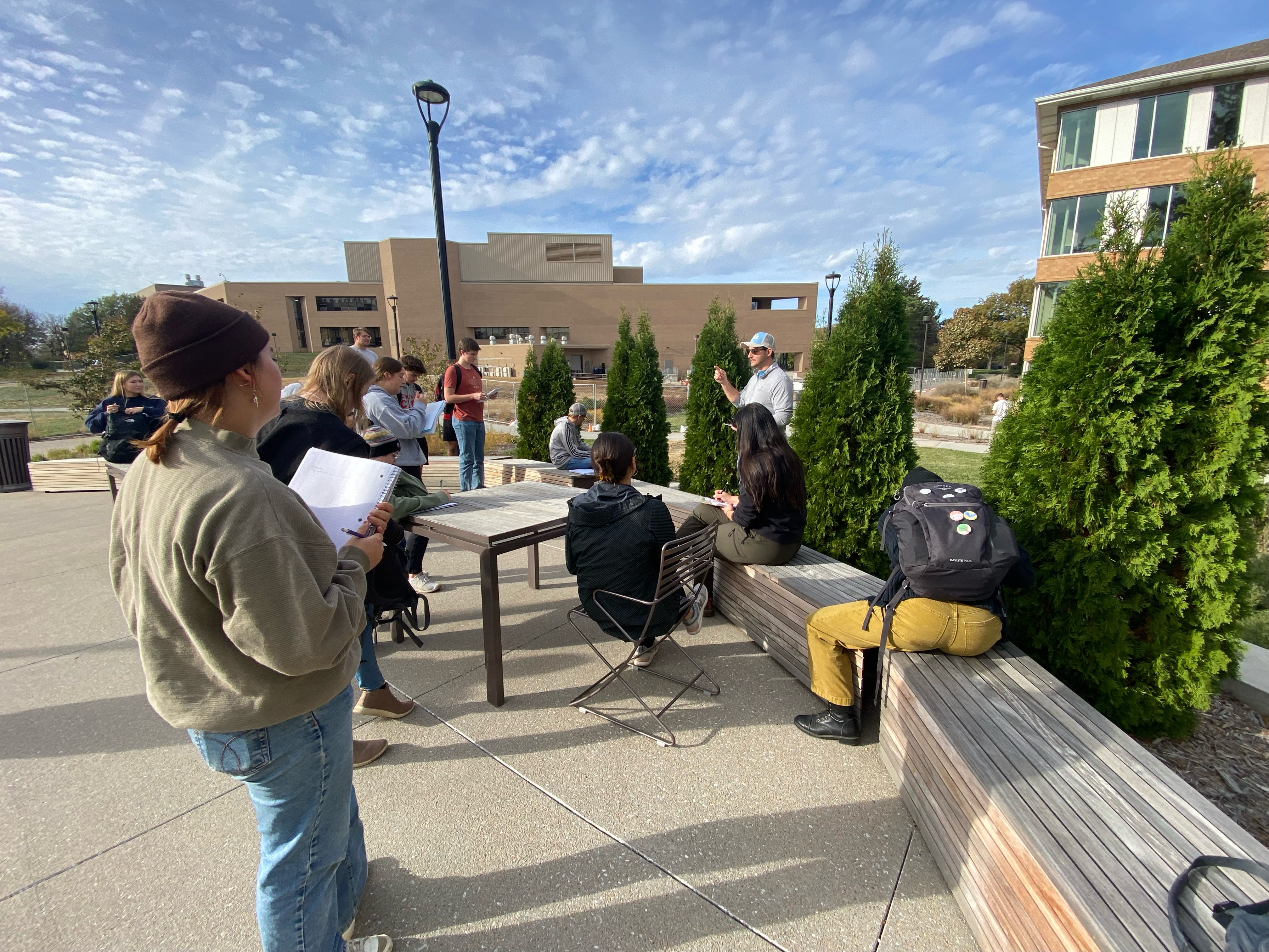 A group of students learning outside the classroom. 