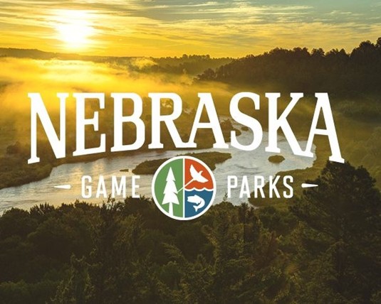 Nebraska Game and Parks logo with water and a sunrise in the background